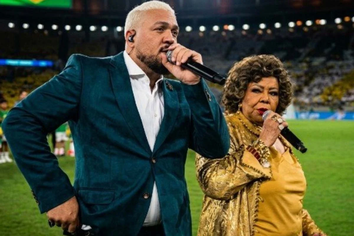 Alcione explica confusão com Belo na apresentação do hino nacional em amistoso da seleção